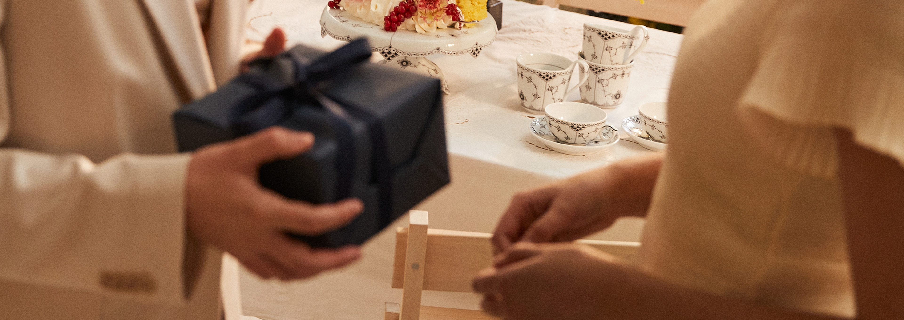 Set the table for the graduation party with high handle cups, cups with saucers and a cake stand from Black Fluted Half Lace.